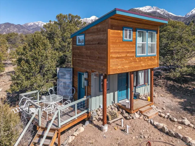 a view of house with outdoor seating
