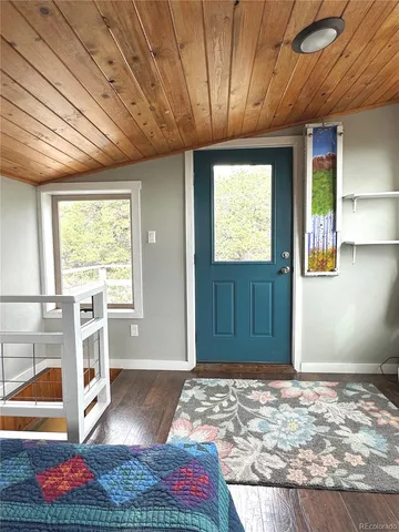 a view of livingroom with furniture window and wooden floor