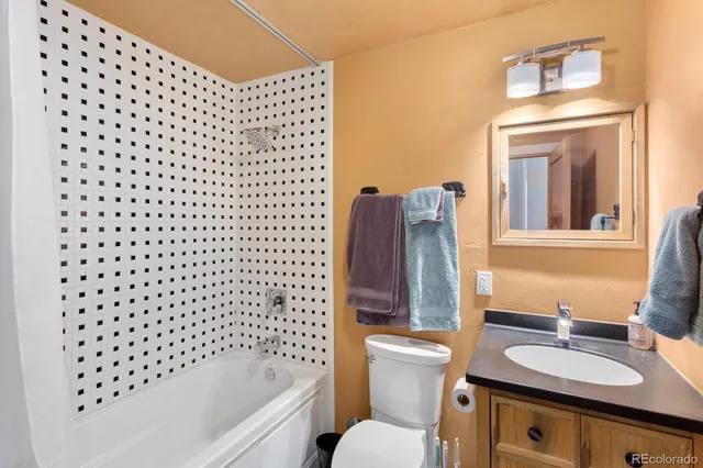a bathroom with a sink a toilet and a bathtub