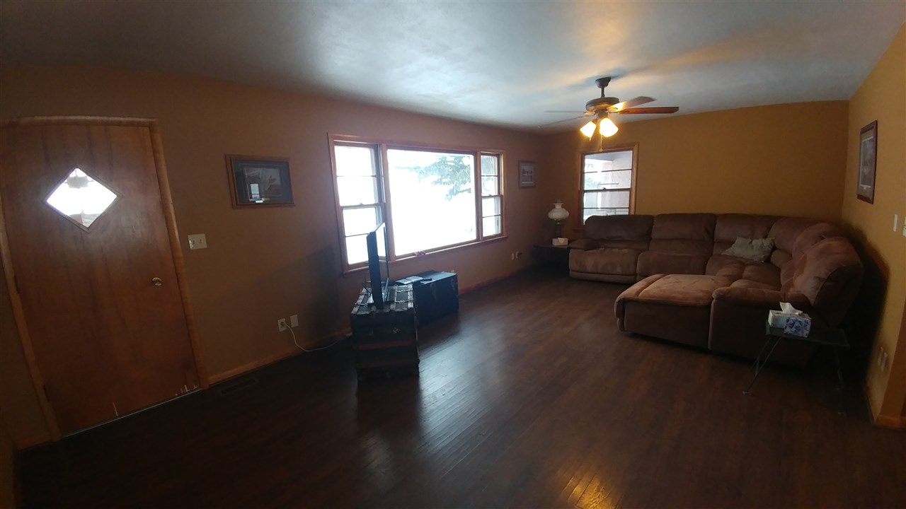 11653 Porter Road Garden Prairie, IL 61038 - Photo 3 of 25 a living room with furniture and a wooden floor