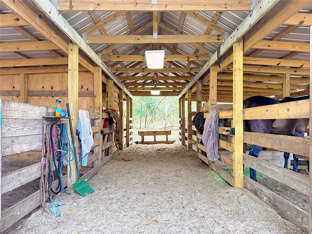3230 Empire Church Road Groveland, FL 34736 - Photo 20 of 29 a view of a garage with wooden walls