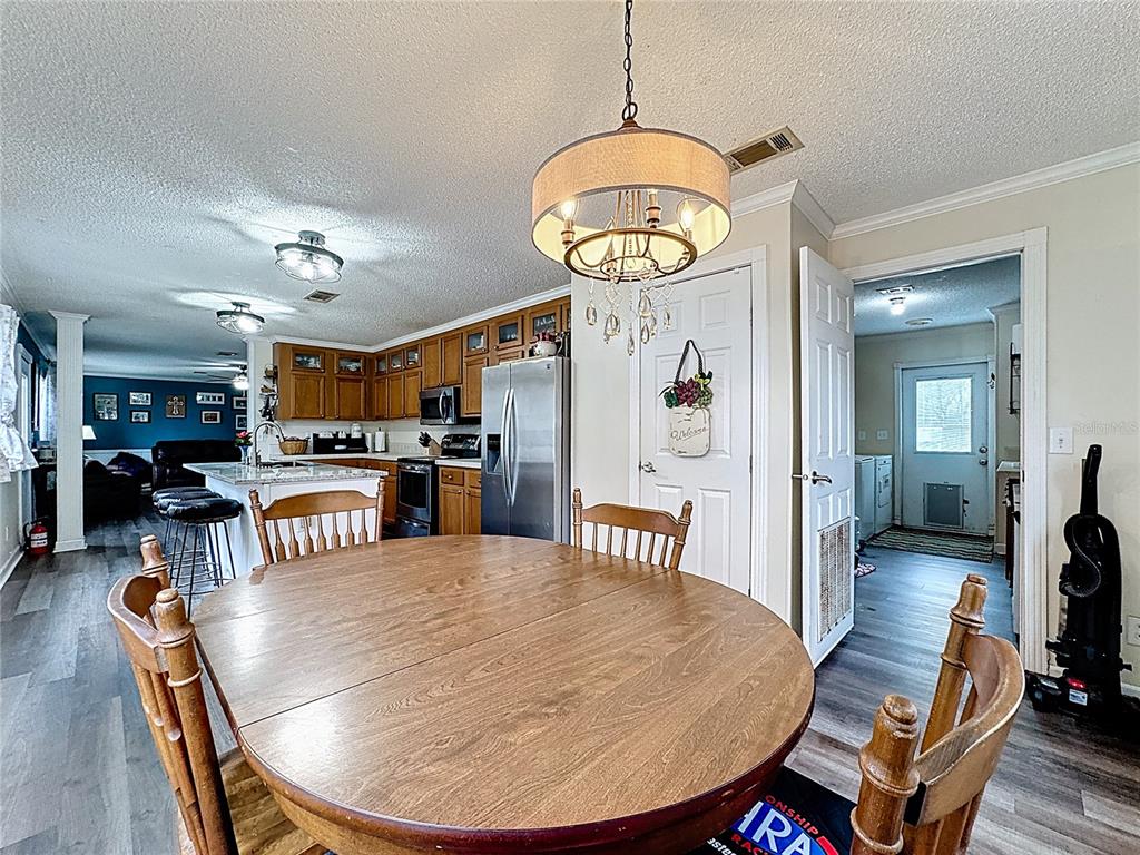 3230 Empire Church Road Groveland, FL 34736 - Photo 7 of 29 a view of a dining room with furniture