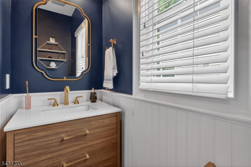 921 Harding Street Westfield, NJ 07090 - Photo 14 of 50 a bathroom with a sink and a mirror