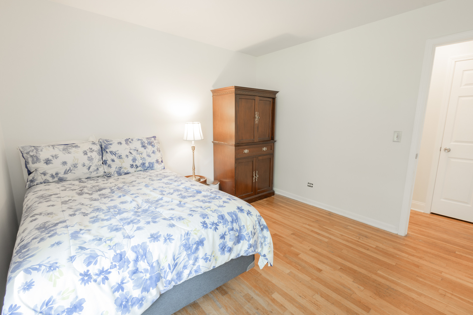 N244 Peter Road Winfield, IL 60190 - Photo 13 of 20 a bedroom with a bed and wooden floor