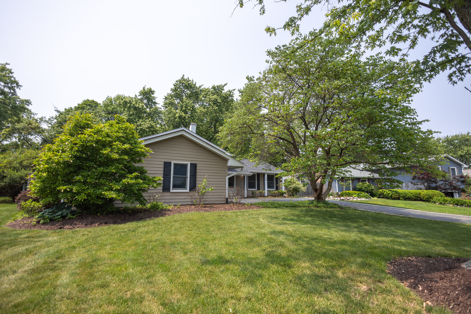 N244 Peter Road Winfield, IL 60190 - Photo 18 of 20 a house view with a garden space