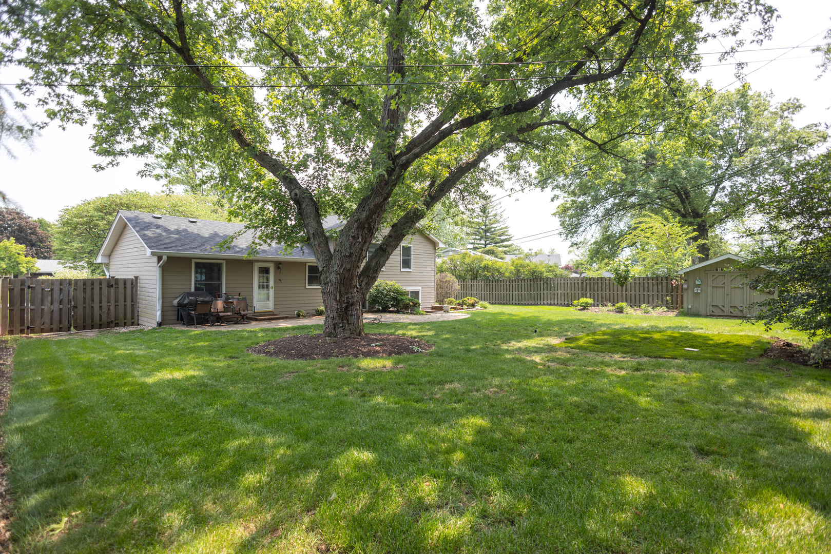 N244 Peter Road Winfield, IL 60190 - Photo 19 of 20 a view of a house with a garden