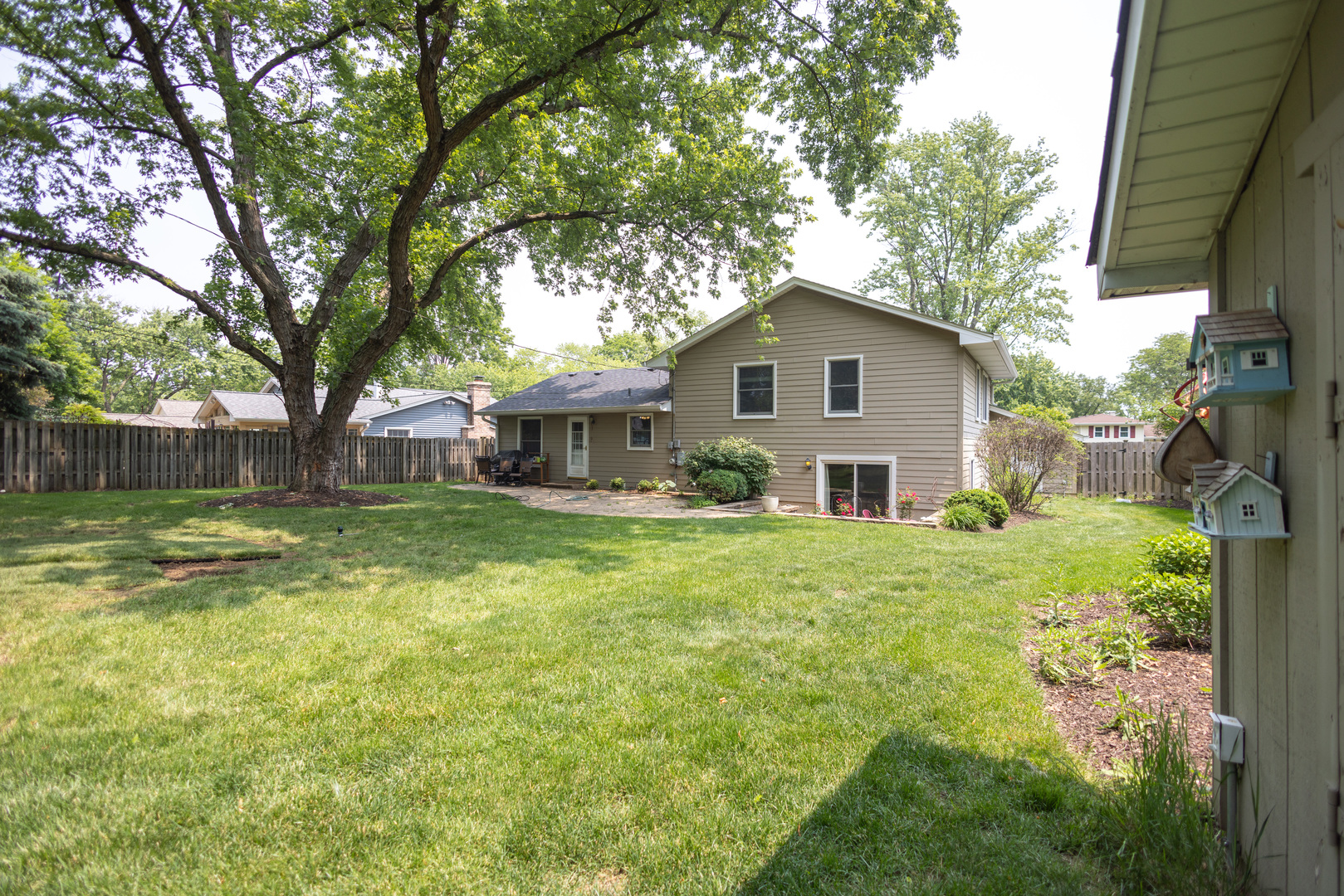 N244 Peter Road Winfield, IL 60190 - Photo 20 of 20 a front view of a house with garden