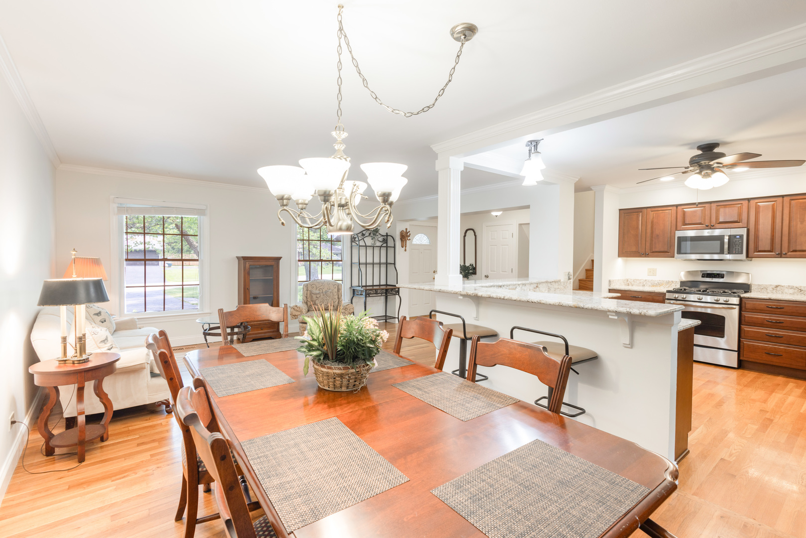 N244 Peter Road Winfield, IL 60190 - Photo 5 of 20 a view of a dining room with furniture a chandelier and wooden floor