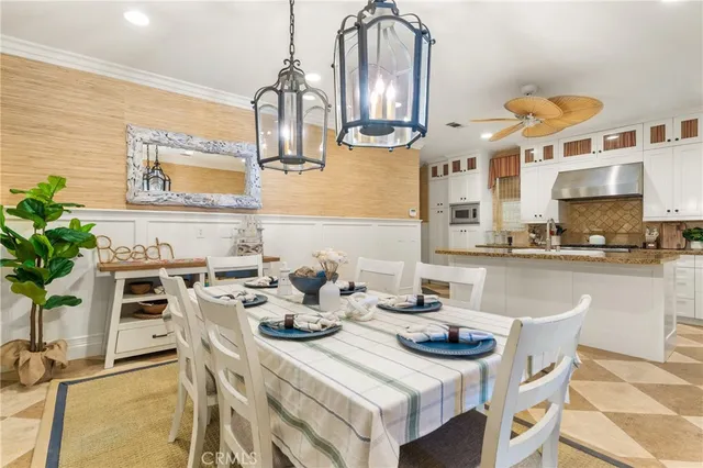 a view of a dining room with furniture and a potted plant