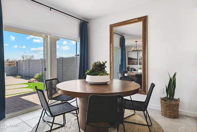 a view of a dining room with furniture and window
