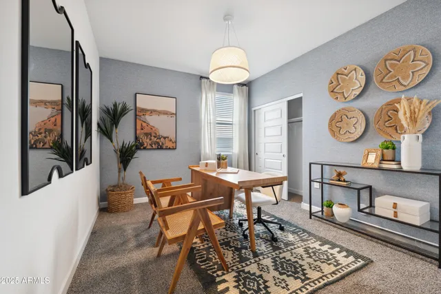 a living room with chair and a table