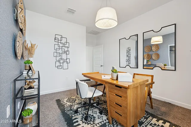 a view of a workspace with furniture