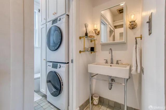a view of a hallway with washer and dryer