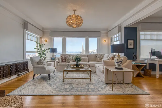 a living room with fireplace furniture and a window