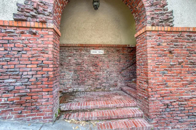 a view of a cars parked in front of a house