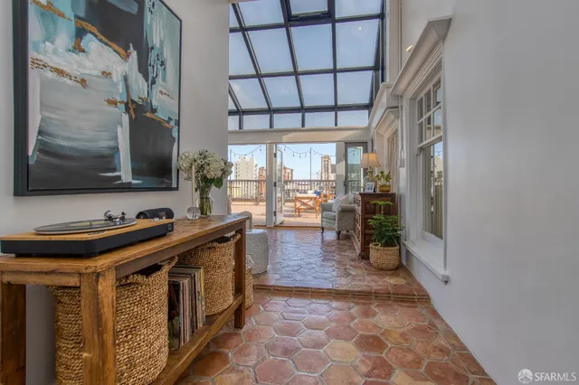 a kitchen with stainless steel appliances a stove a sink and a refrigerator