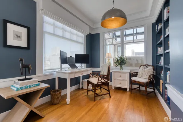 a workspace with furniture and a potted plant