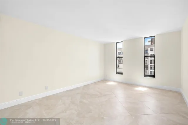 an empty room with windows