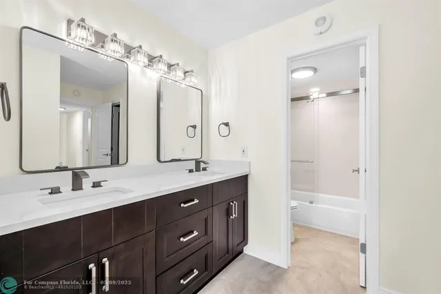 a bathroom with a shower a toilet and a bathtub