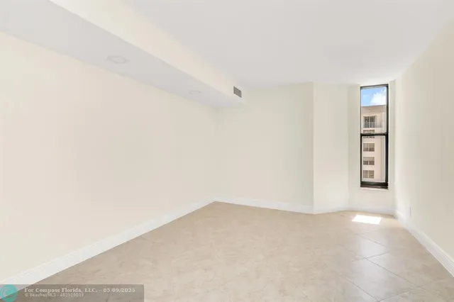 a view of empty room with closet