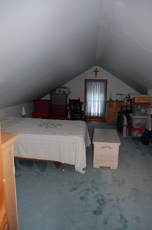 5 Knox Trail Road Warren, MA 01083 - Photo 17 of 28 a bed room with furniture and a chandelier