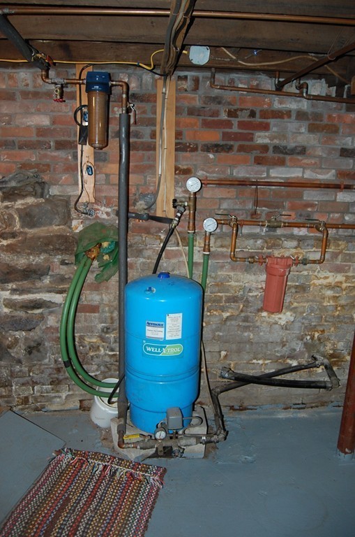 5 Knox Trail Road Warren, MA 01083 - Photo 19 of 28 a room with water heater and storage racks