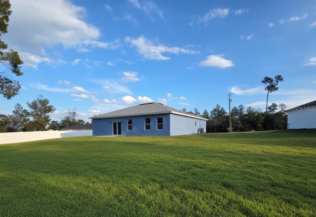 4863 Southwest 159th Lane Ocala, FL 34473 - Photo 2 of 16 a view of a house with a yard
