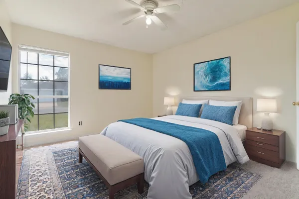 a bedroom with a bed and a window