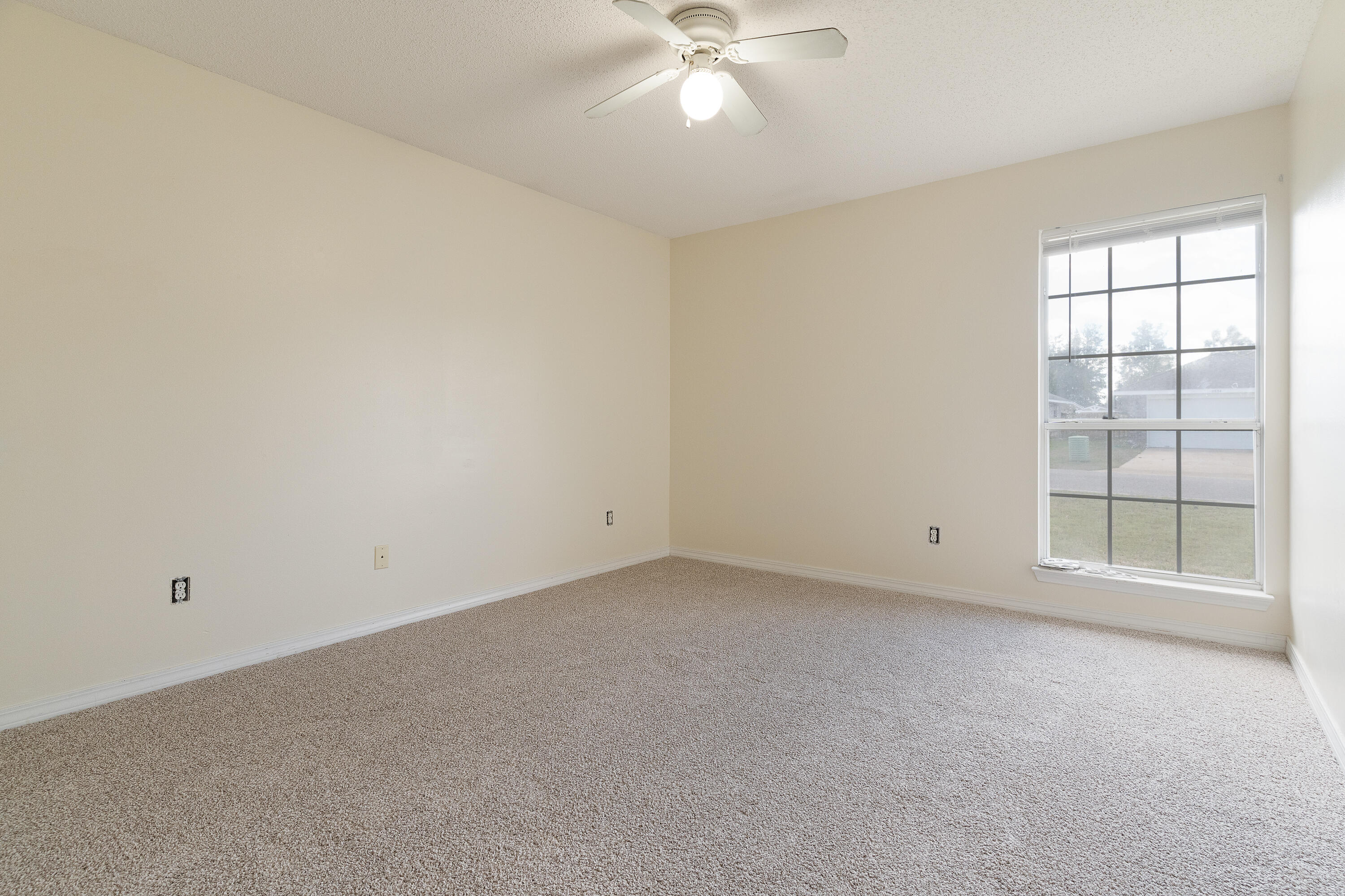 2837 Tamiami Trail Crestview, FL 32539 - Photo 26 of 33 wooden floor in an empty room with a window