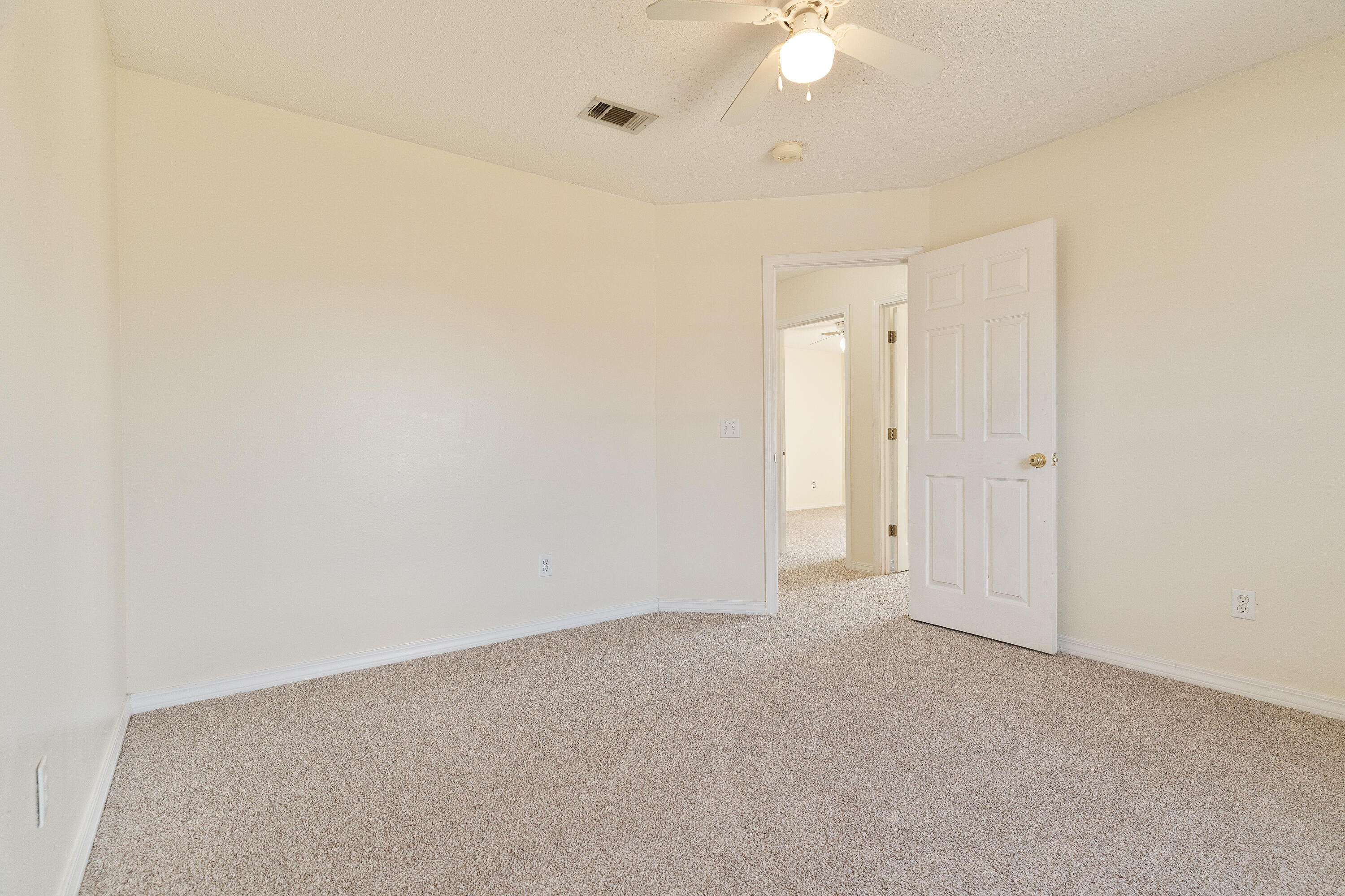 2837 Tamiami Trail Crestview, FL 32539 - Photo 31 of 33 an empty room with a ceiling fan and a window