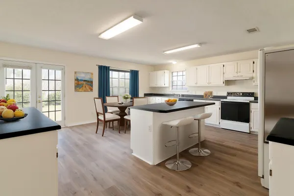 a kitchen with a sink a counter top space and appliances