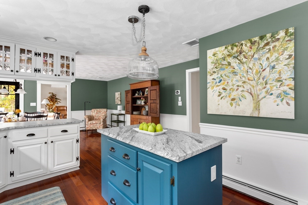 8 Bubbling Brook Road Franklin, MA 02038 - Photo 11 of 46 a view of a kitchen area with furniture and wooden floor