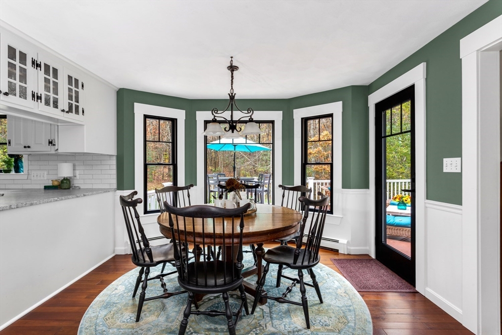 8 Bubbling Brook Road Franklin, MA 02038 - Photo 13 of 46 a view of a dining room with furniture window and wooden floor