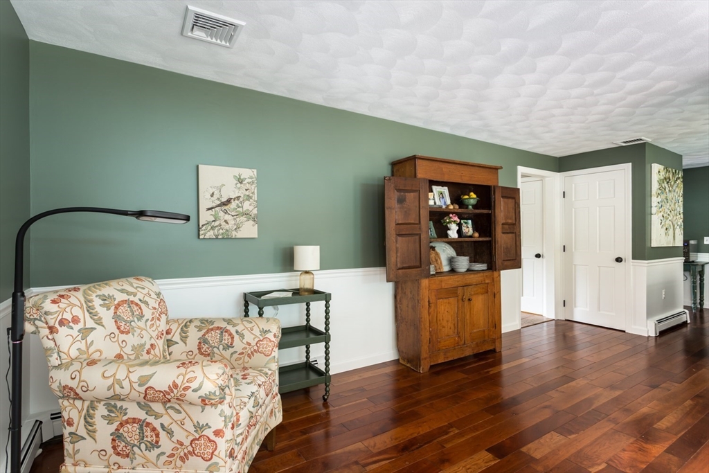 8 Bubbling Brook Road Franklin, MA 02038 - Photo 14 of 46 a bedroom with a bed and a wooden floor