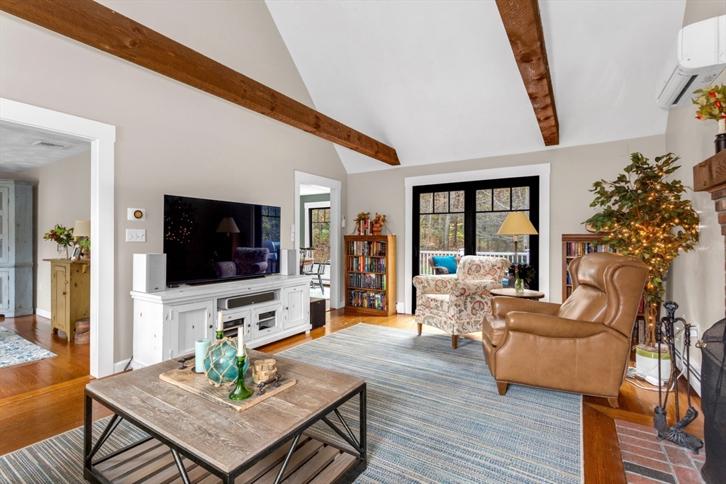 8 Bubbling Brook Road Franklin, MA 02038 - Photo 16 of 46 a living room with furniture and a flat screen tv