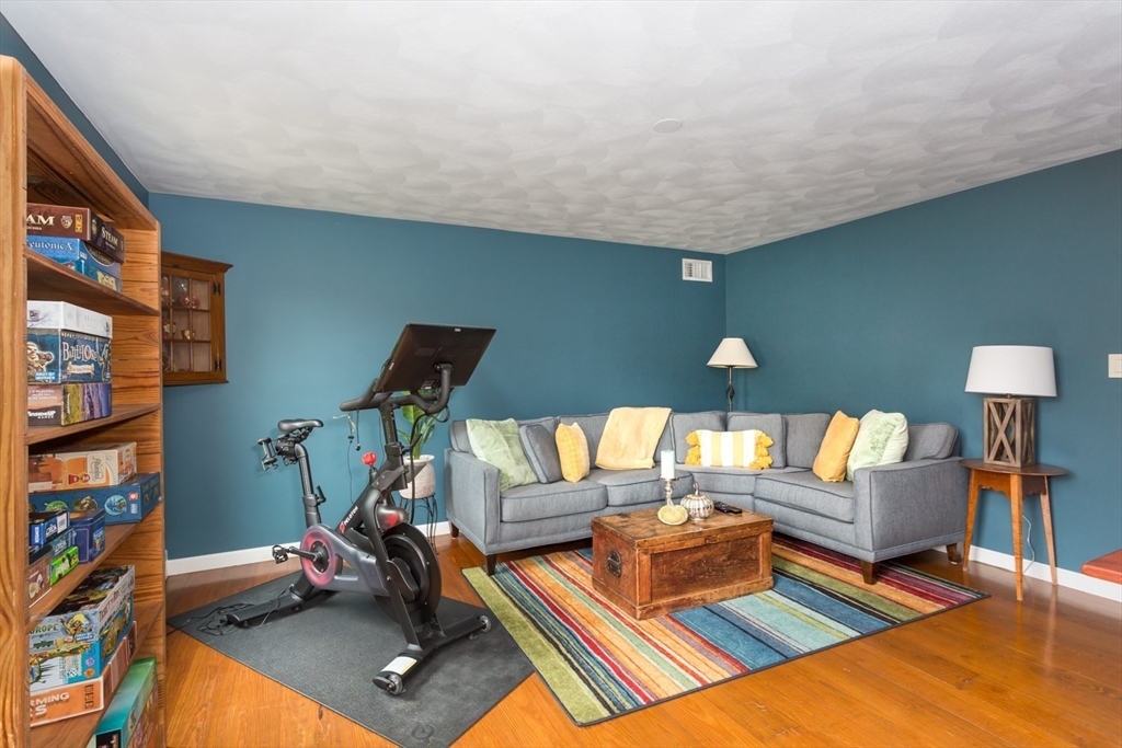 8 Bubbling Brook Road Franklin, MA 02038 - Photo 19 of 46 a living room with furniture and a wooden floor