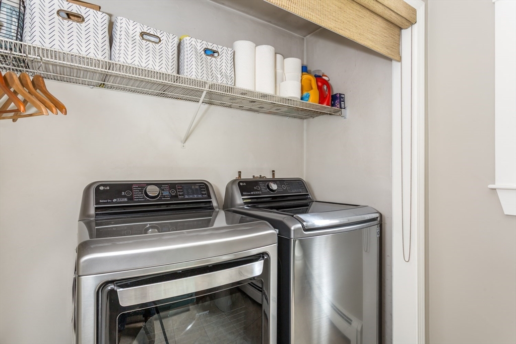 8 Bubbling Brook Road Franklin, MA 02038 - Photo 21 of 46 a utility room with dryer washer and empty racks