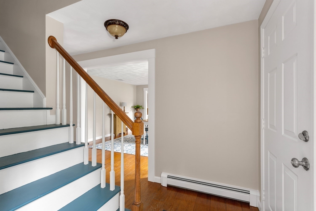 8 Bubbling Brook Road Franklin, MA 02038 - Photo 22 of 46 a view of a hallway with staircase