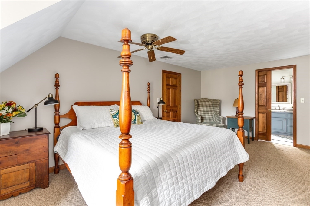 8 Bubbling Brook Road Franklin, MA 02038 - Photo 23 of 46 a bedroom with a bed and ceiling fan