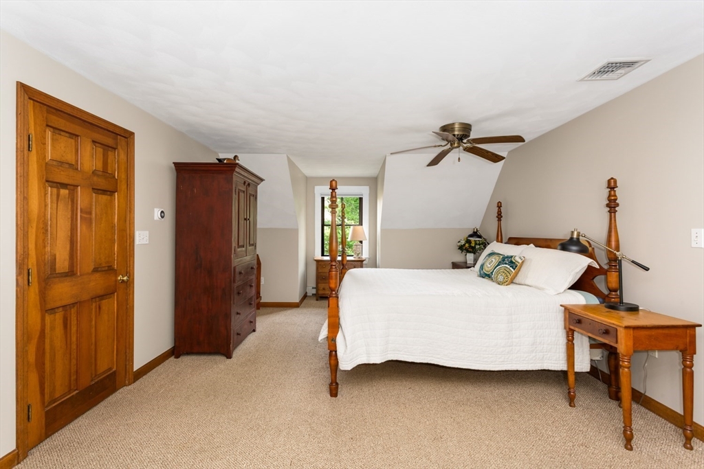 8 Bubbling Brook Road Franklin, MA 02038 - Photo 24 of 46 a bedroom with a bed and a table