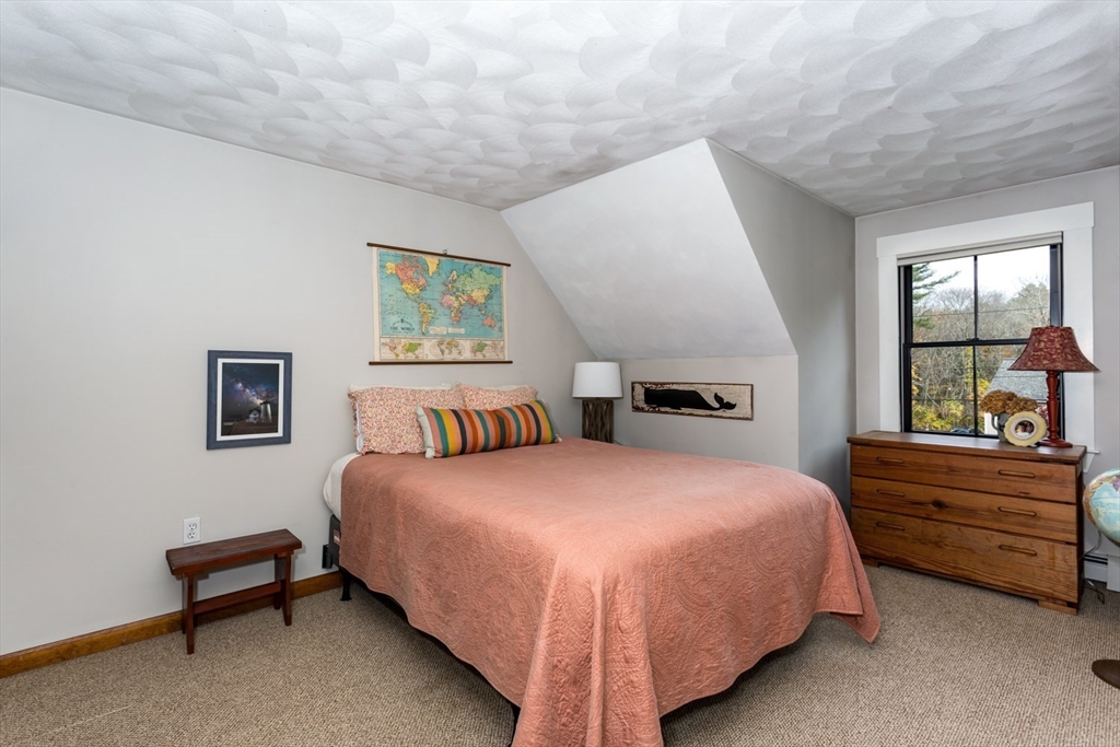 8 Bubbling Brook Road Franklin, MA 02038 - Photo 27 of 46 a bedroom with a bed and a window