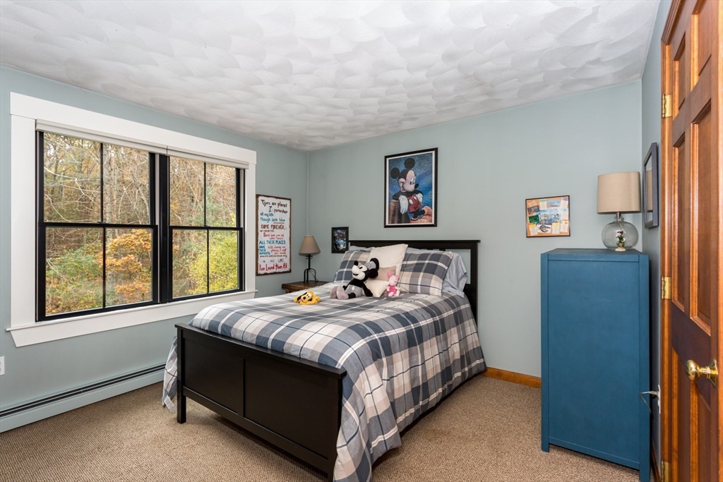 8 Bubbling Brook Road Franklin, MA 02038 - Photo 28 of 46 a bedroom with a bed and a large window