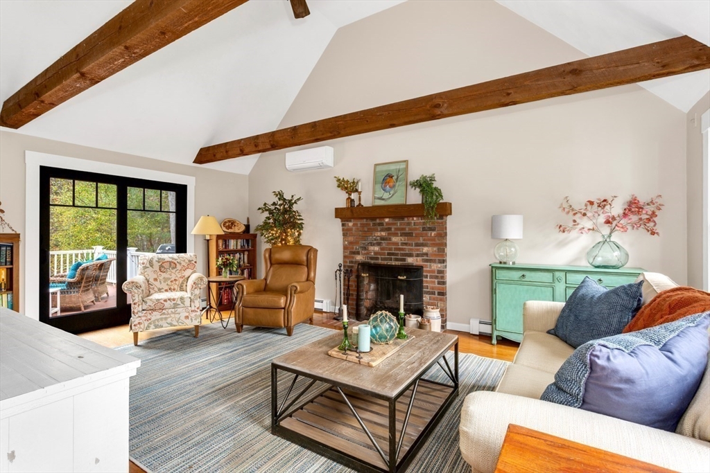 8 Bubbling Brook Road Franklin, MA 02038 - Photo 3 of 46 a living room with furniture and a fireplace