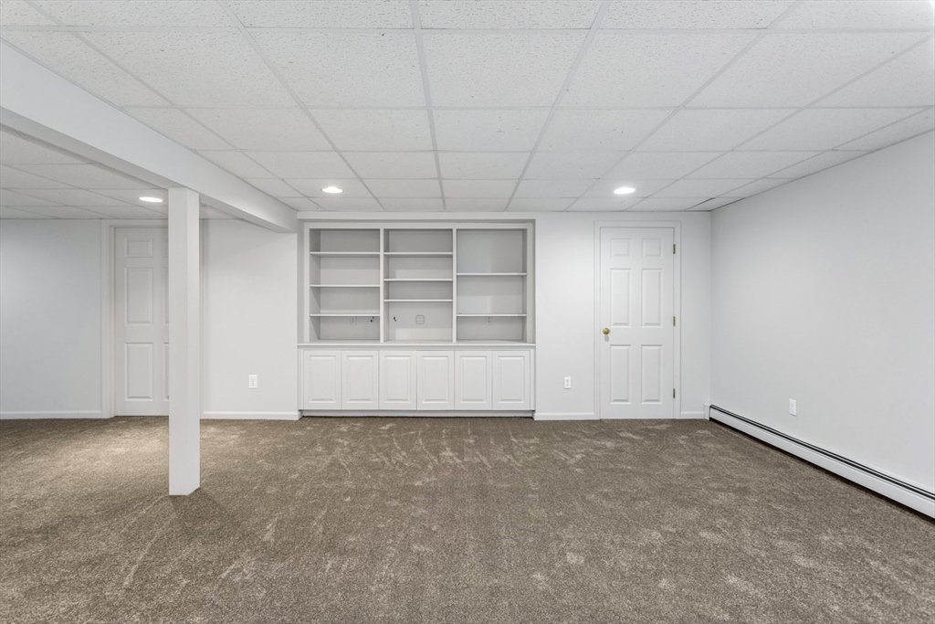 8 Bubbling Brook Road Franklin, MA 02038 - Photo 33 of 46 an empty room with windows