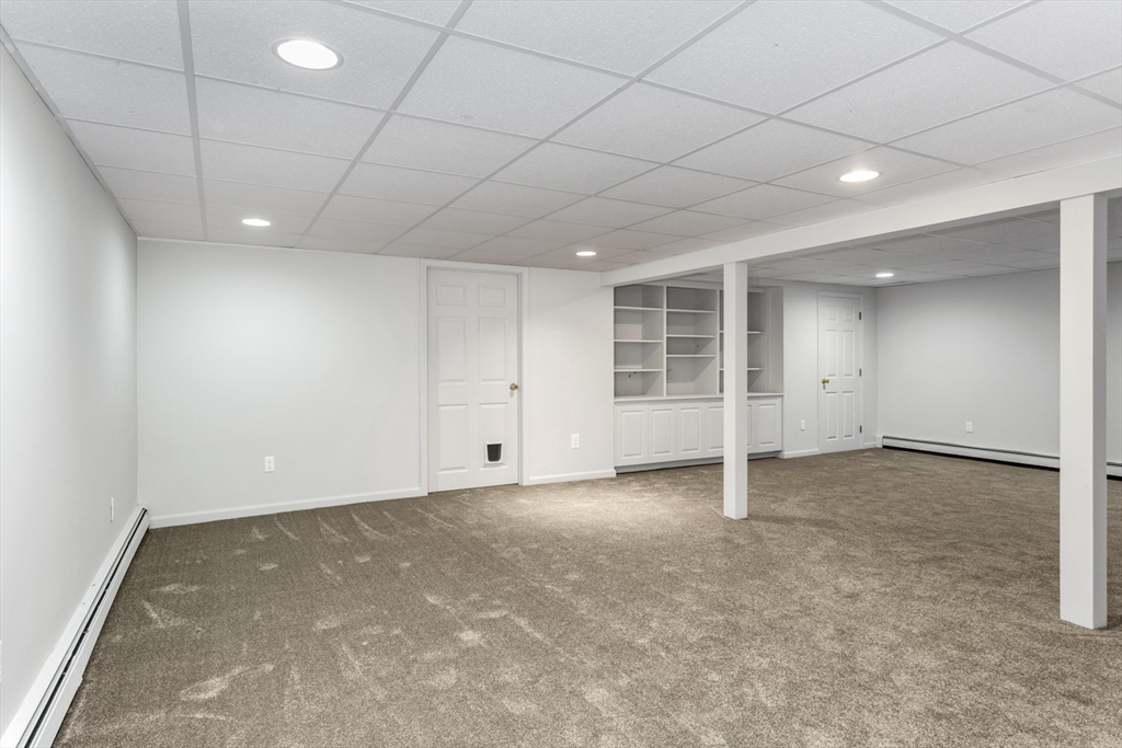 8 Bubbling Brook Road Franklin, MA 02038 - Photo 34 of 46 an empty room with windows