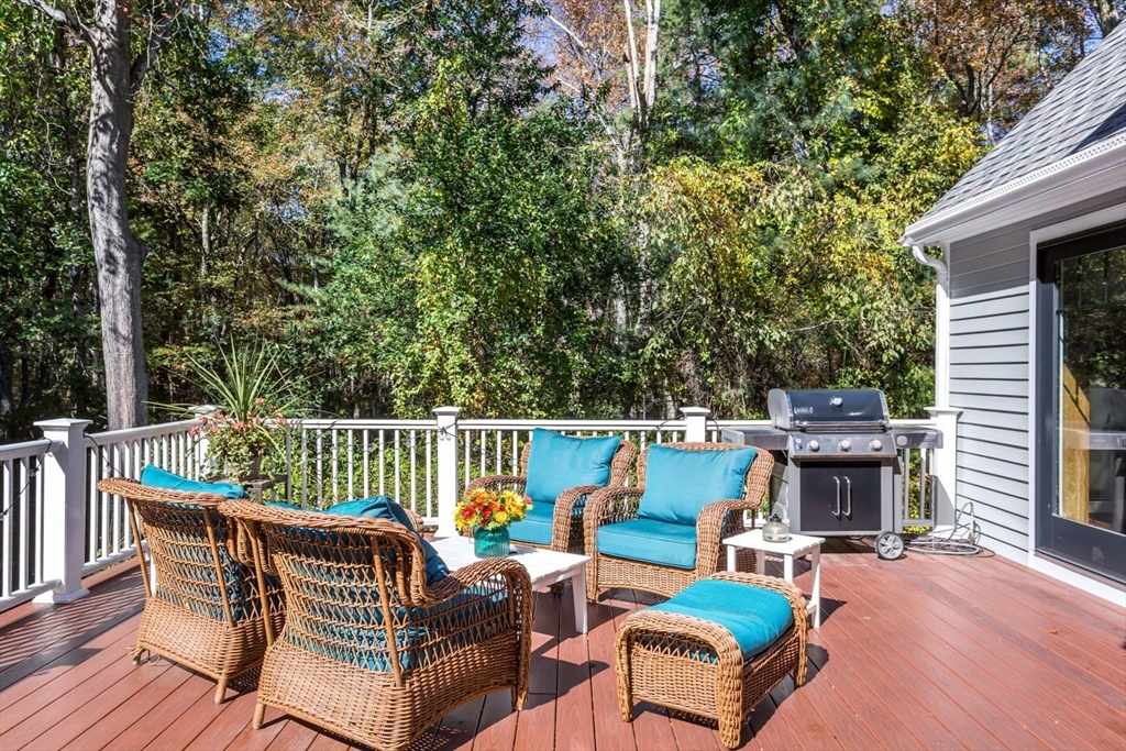 8 Bubbling Brook Road Franklin, MA 02038 - Photo 36 of 46 a view of a patio with a table and chairs