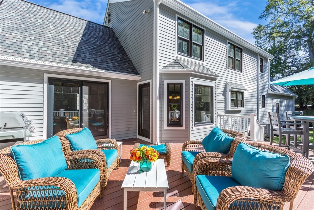 8 Bubbling Brook Road Franklin, MA 02038 - Photo 37 of 46 a view of a patio with couches chairs and potted plants