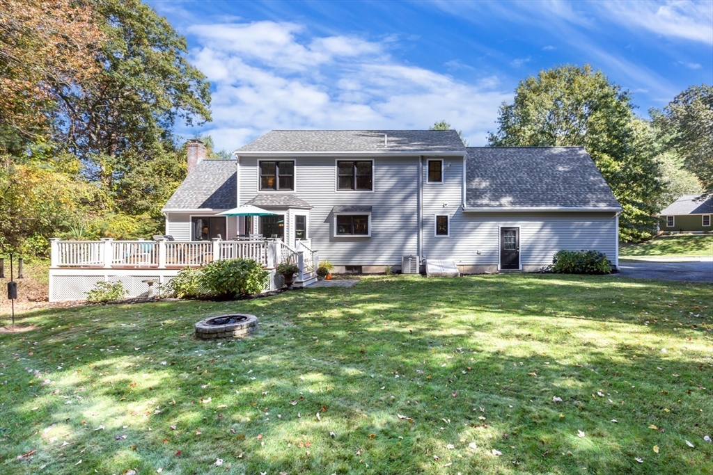 8 Bubbling Brook Road Franklin, MA 02038 - Photo 41 of 46 a front view of house with yard and green space