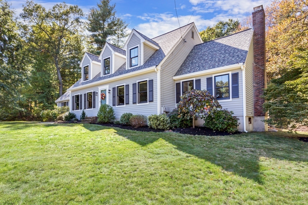 8 Bubbling Brook Road Franklin, MA 02038 - Photo 42 of 46 front view of a house with a yard