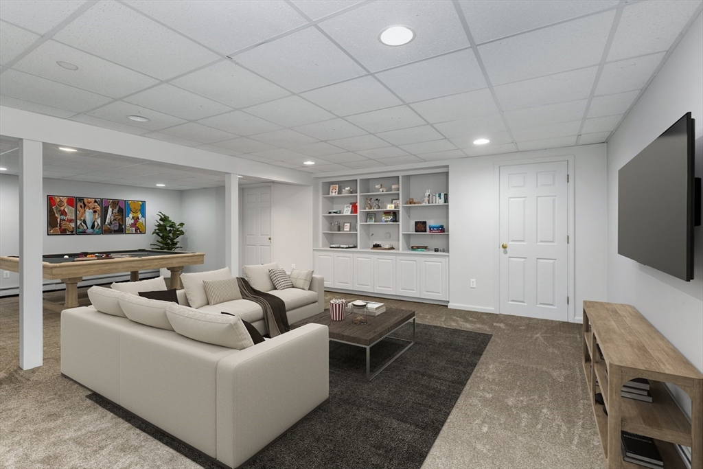 8 Bubbling Brook Road Franklin, MA 02038 - Photo 5 of 46 a living room with furniture and a flat screen tv